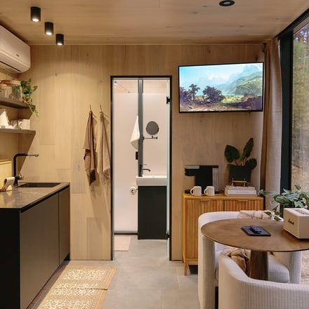 Modern kitchen with white island and sliding barn door